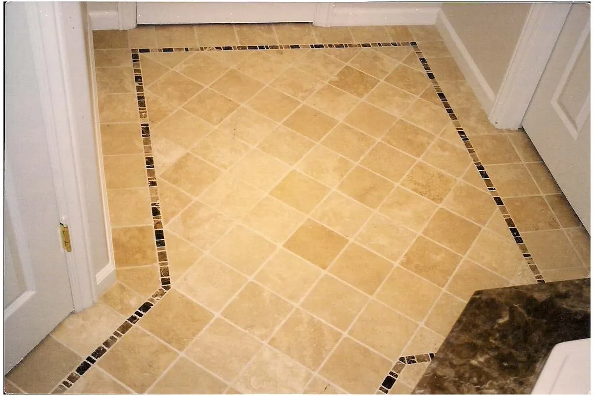 Remodeled bathroom with precise tile coursing around the vanity and tub.
